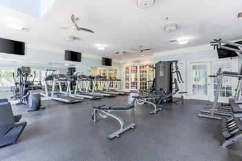 A spacious gym with a variety of equipment including treadmills, elliptical machines, and weight machines.at Riverview Landing @ Valley Forge, Eagleville, 19403